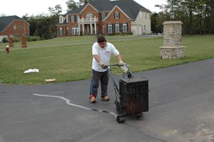 Hot pour asphalt driveway crack filling